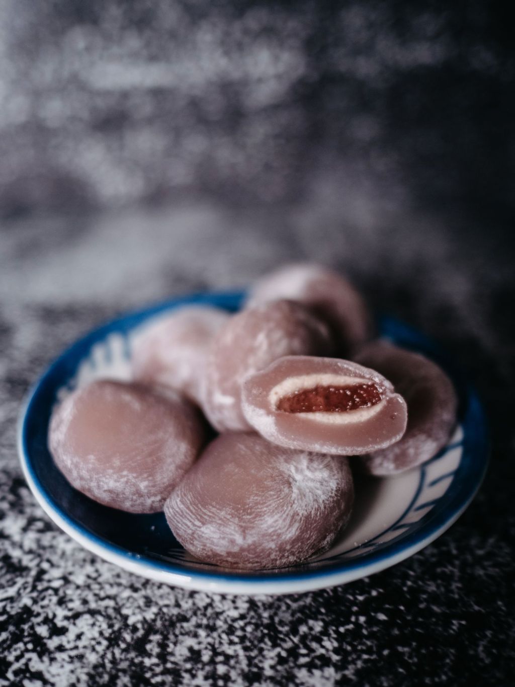 Soft glutinous rice cakes filled with sweet red bean paste on a plate