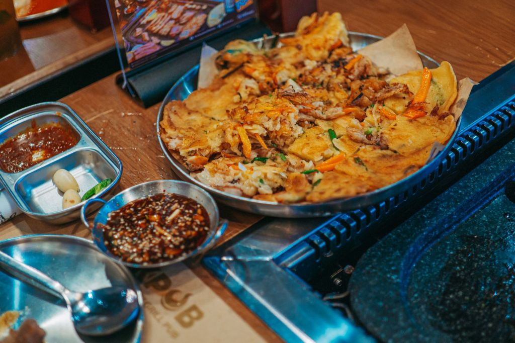 Korean green onion pancake pajeon served with soy vinegar dipping sauce