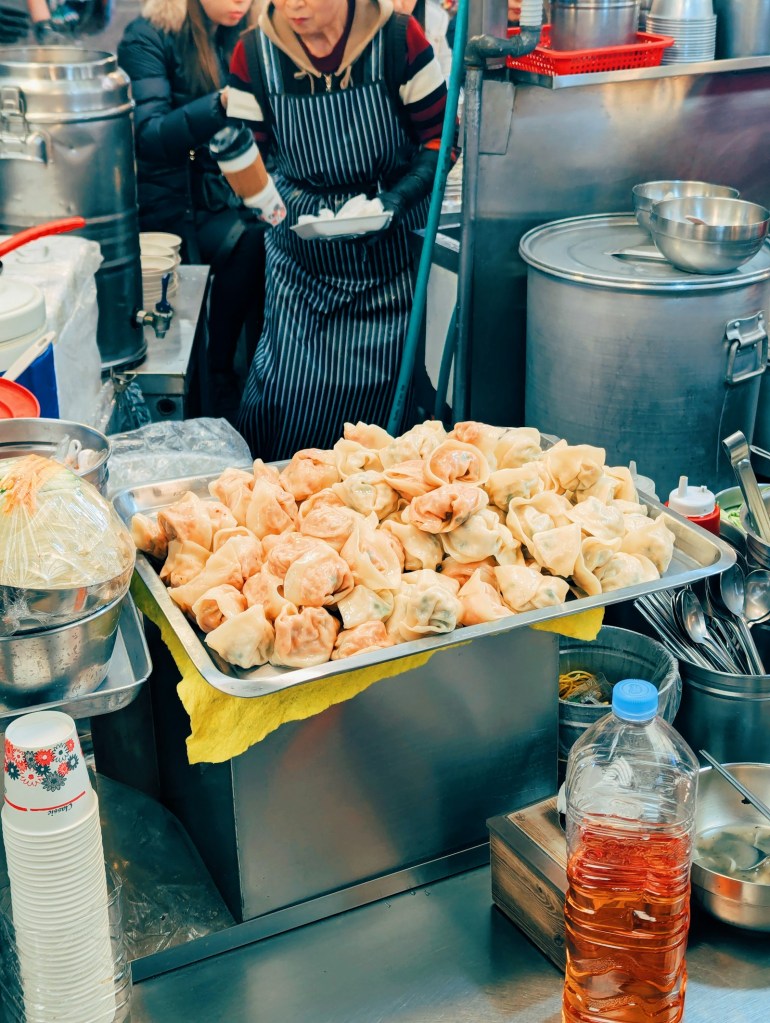 Tray of freshly cooked dumplings at a food stall
