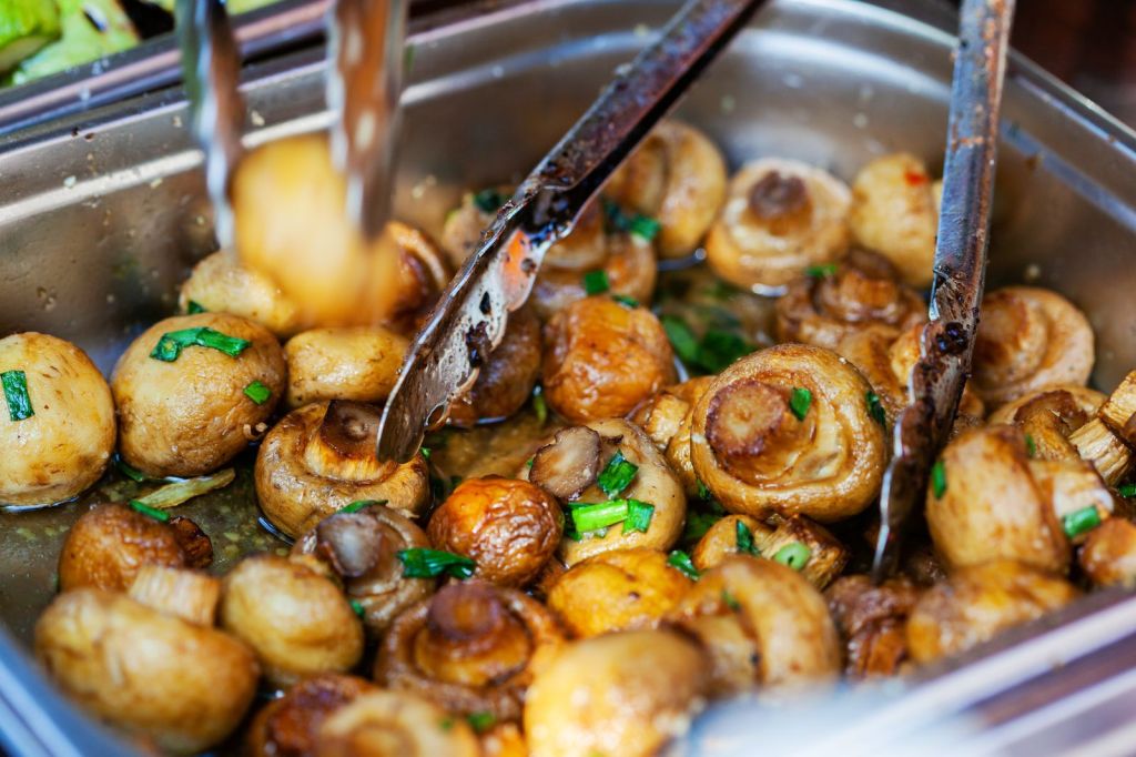 Sautéed mushrooms glazed with butter and soy sauce, garnished with green onions