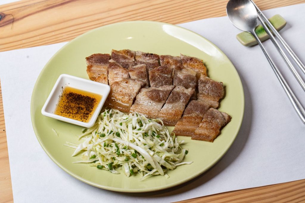 Grilled Korean pork with a fresh shredded vegetable salad and dipping sauce
