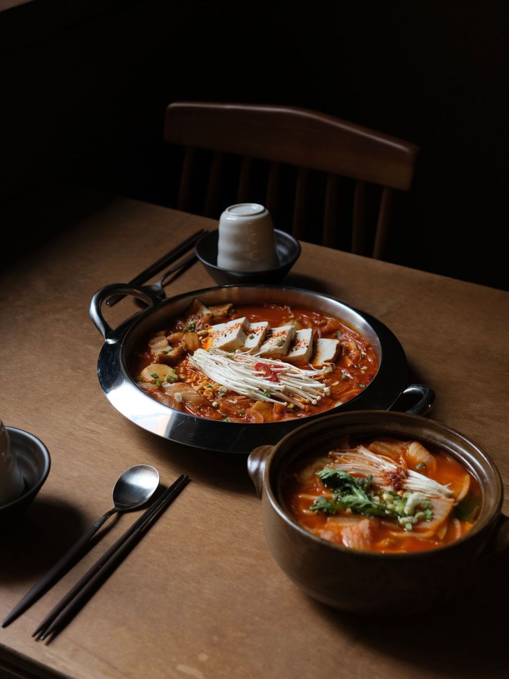Korean hot pot (jeongol) with tofu, mushrooms and vegetables in broth