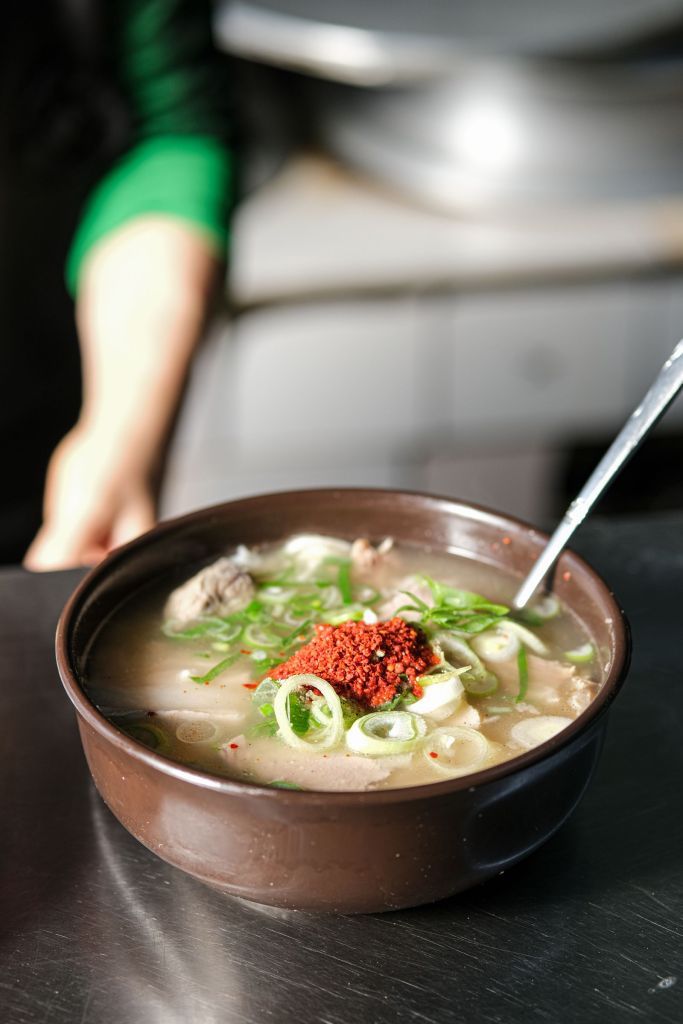 Bowl of Korean beef bone soup topped with chopped green onions