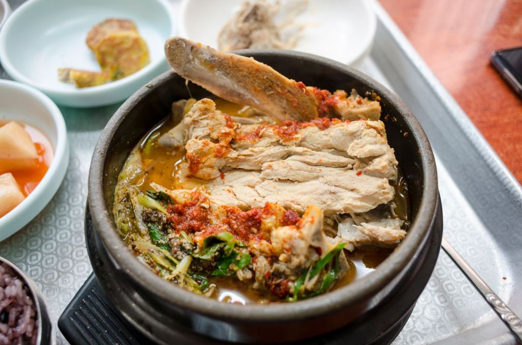 Bubbling Korean doenjang-style stew in a traditional clay pot (ttukbaegi)