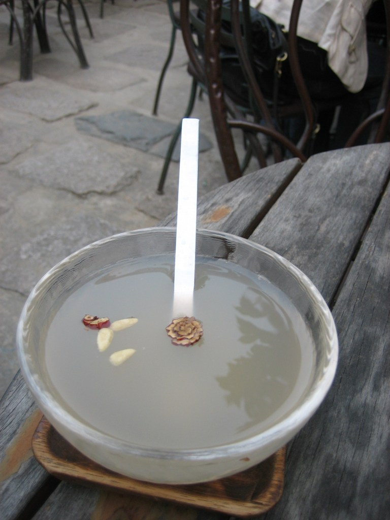 Sikhye, a sweet Korean rice punch with floating rice grains, made with yeotgireum barley malt